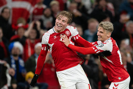 Rasmus Højlund and Jens Stryger of Denmark celebrate the