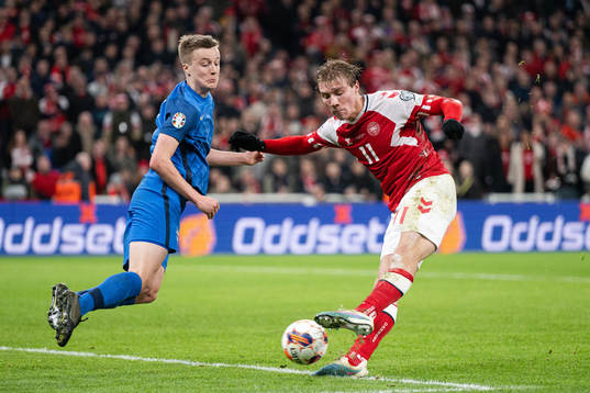 Rasmus Højlund of Denmark scores the 3-1 goal behind