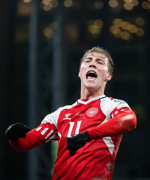 Rasmus Højlund of Denmark celebrates