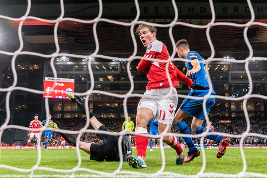 Rasmus Højlund of Denmark against goalkeeper Lukas