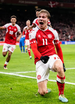 Rasmus Højlund of Denmark celebrates