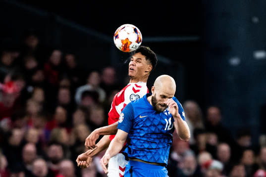 Alexander Bah of Denmark and Teemu Pukki of Finland