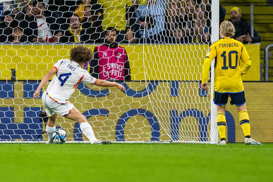 Wout Faes of Belgium saves the ball