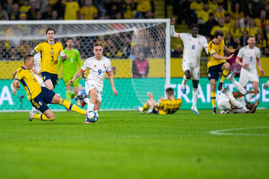 Ludvig Augustinsson of Sweden and Leandro Trossard of