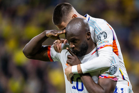 Romelu Lukaku of Belgium celebrates with Yannick Carrasco