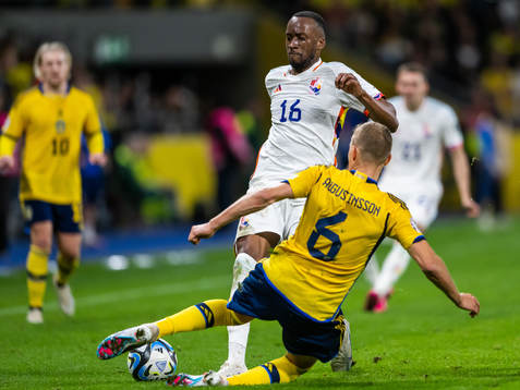 Dodi Lukebakio of Belgium and Ludvig Augustinsson of Sweden