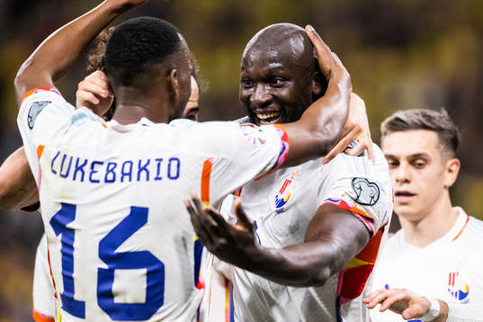 Romelu Lukaku of Belgium celebrates with Dodi Lukebakio