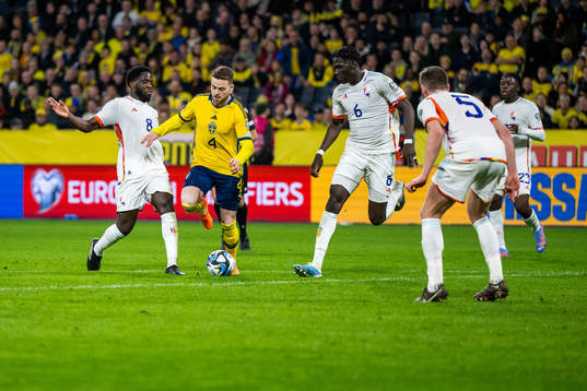 Orel Mangala and Amadou Onana of Belgium compete for the