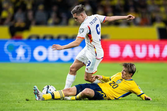 Leandro Trossard of Belgium and Kristoffer Olsson of Sweden