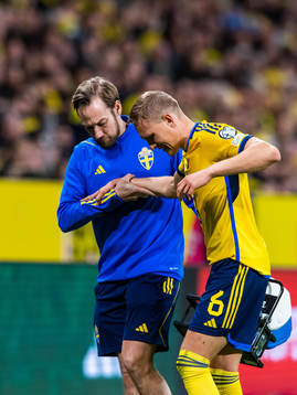 Ludvig Augustinsson of Sweden leaves the pitch due to injury