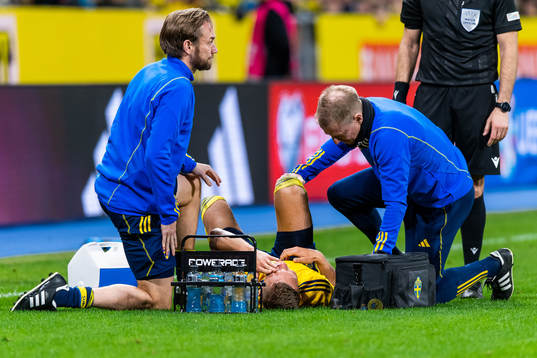 Ludvig Augustinsson of Sweden receives medical attention