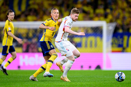 Ludvig Augustinsson of Sweden and Kevin de Bruyne of Belgium