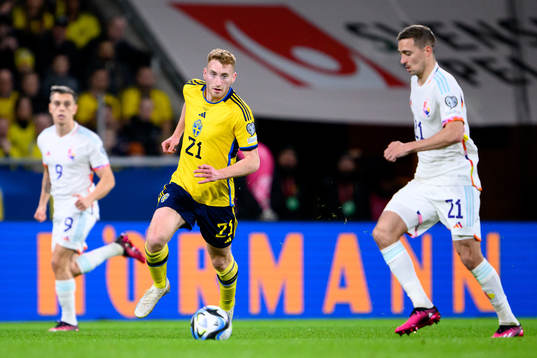 Dejan Kulusevski of Sweden and Timothy Castagne of Belgium