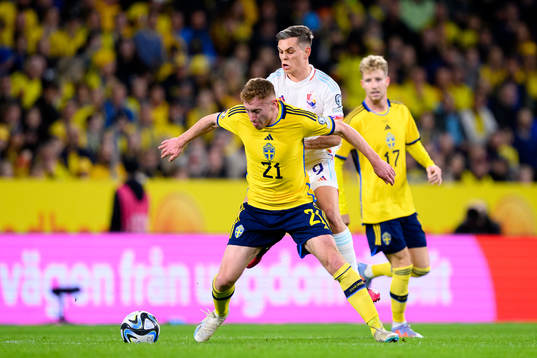 Dejan Kulusevski of Sweden and Leandro Trossard of Belgium