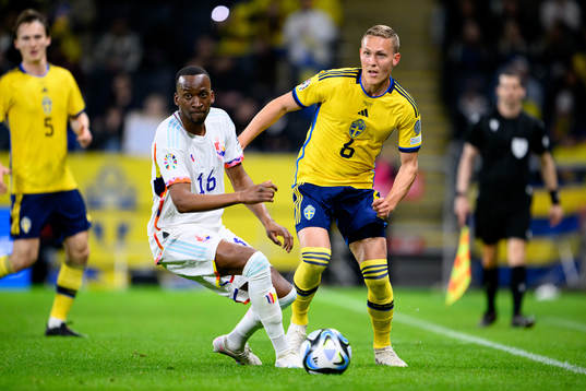 Dodi Lukebakio of Belgium and Ludvig Augustinsson of Sweden
