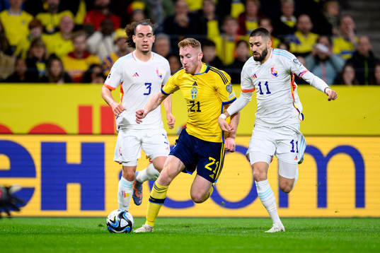 Dejan Kulusevski of Sweden and Yannick Carrasco of Belgium