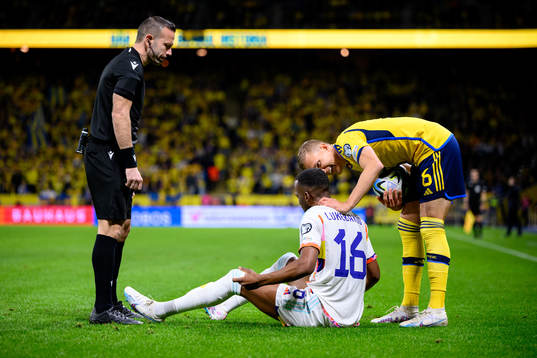 Dodi Lukebakio of Belgium and Ludvig Augustinsson of Sweden