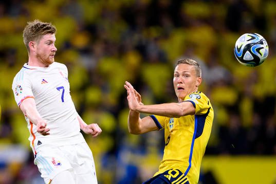 Kevin de Bruyne of Belgium and Ludvig Augustinsson of Sweden