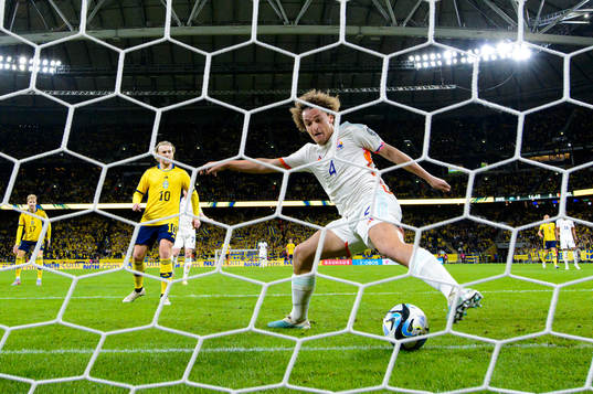 Wout Faes of Belgium stops the ball