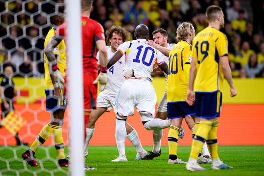Romelu Lukaku of Belgium celebrates with Wout Faes and Jan