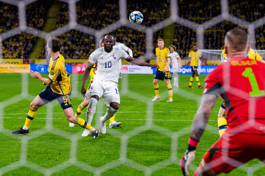 Hjalmar Ekdal of Sweden and Romelu Lukaku of Belgium