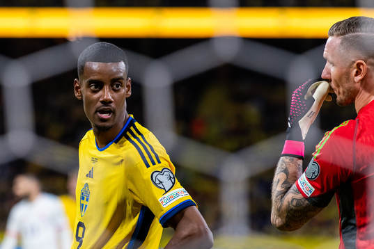 Alexander Isak and goalkeeper Robin Olsen of Sweden