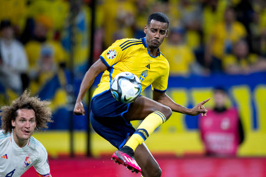 Alexander Isak of Sweden and Wout Faes of Belgium