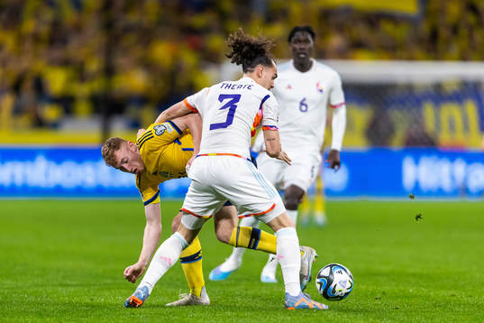 Dejan Kulusevski of Sweden and Arthur Theate of Belgium