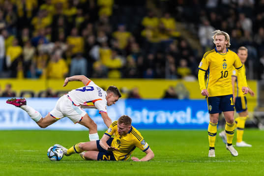Leandro Trossard of Belgium competes for the ball with