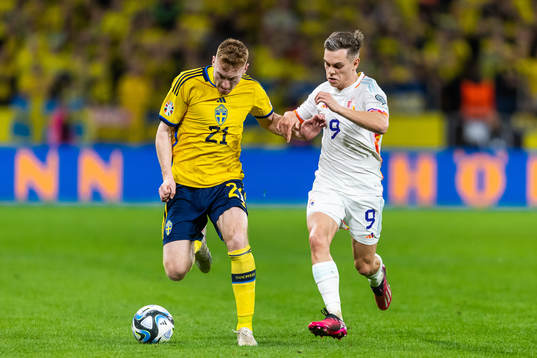 Dejan Kulusevski of Sweden and Leandro Trossard of Belgium