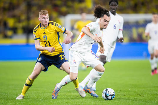 Dejan Kulusevski of Sweden and Arthur Theate of Belgium