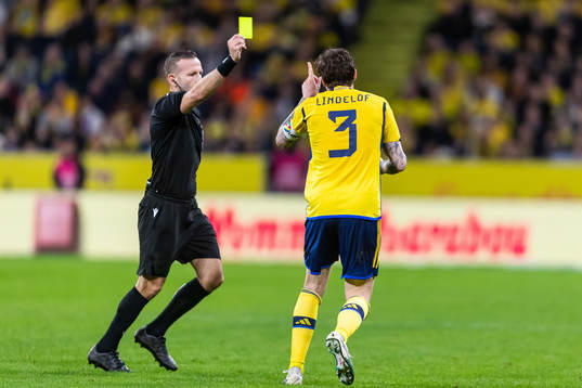 Referee Orel Grinfeeld gives yellow card to Victor Nilsson
