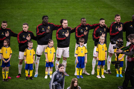 Players of Belgium with mascots