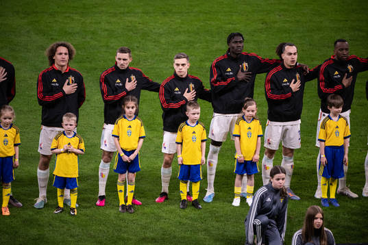 Players of Belgium with mascots