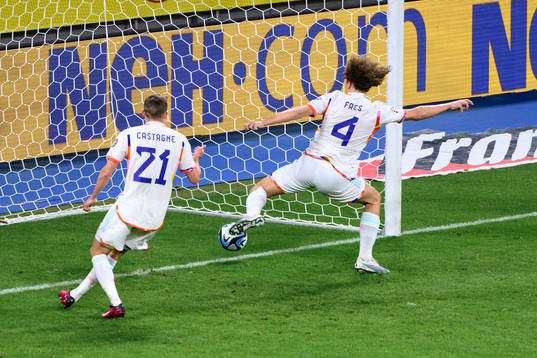 Wout Faes of Belgium stops the ball