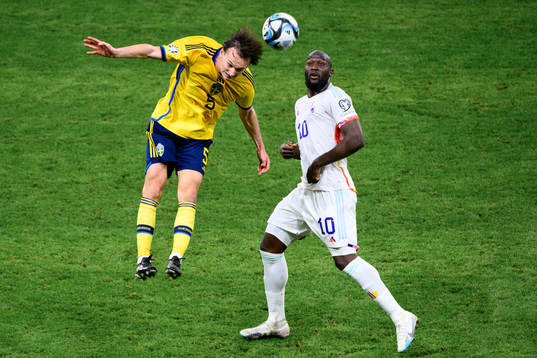 Hjalmar Ekdal of Sweden and Romelu Lukaku of Belgium