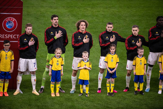 Players of Belgium with mascots