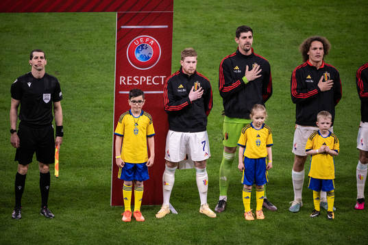 Players of Belgium with mascots