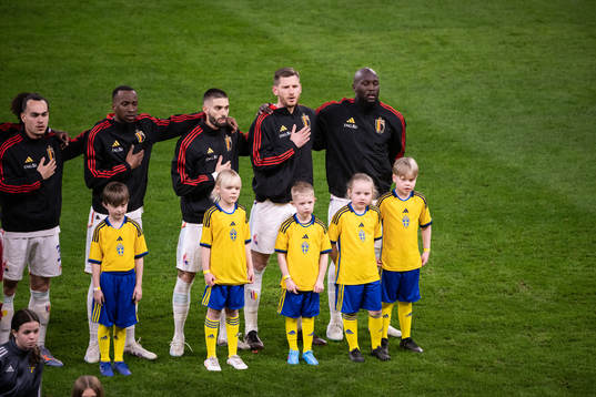 Players of Belgium with mascots