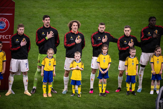 Players of Belgium with mascots