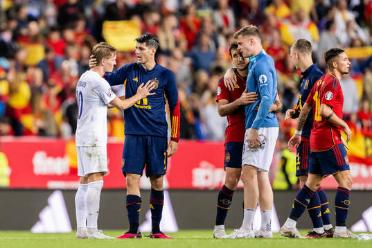 Martin Ødegaard of Norway and Álvaro Morata of Spain