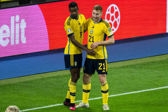 Alexander Isak and Dejan Kulusevski of Sweden celebrate