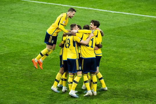 Viktor Gyökeres of Sweden celebrates with teammates