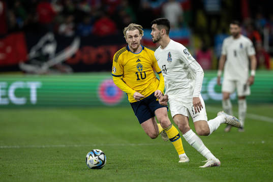Emil Forsberg of Sweden and Toral Bayramov of Azerbaijan
