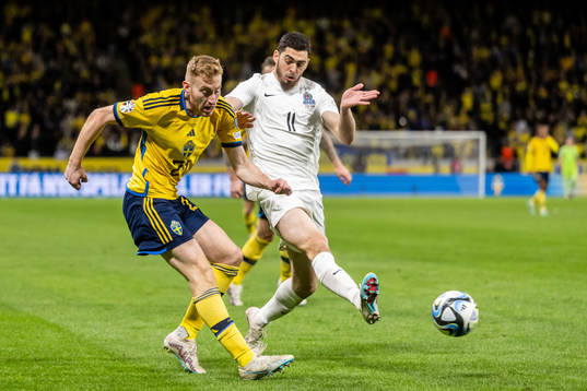 Dejan Kulusevski of Sweden and Ramil Sheydayev of Azerbaijan