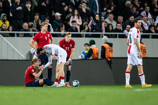 Martin Ødegaard of Norway and Khvicha Kvaratskhelia of