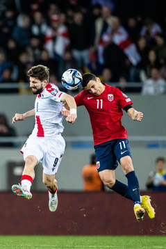 Budu Zivzivadze of Georgia and Mohamed Elyounoussi of Norway