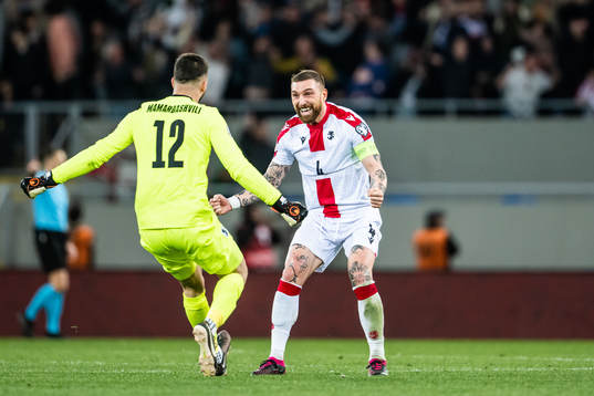 goalkeeper Giorgi Mamardashvili and Guram Kashia of Georgia