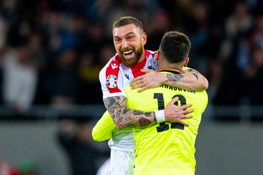 Goalkeeper Giorgi Mamardashvili and Guram Kashia of Georgia