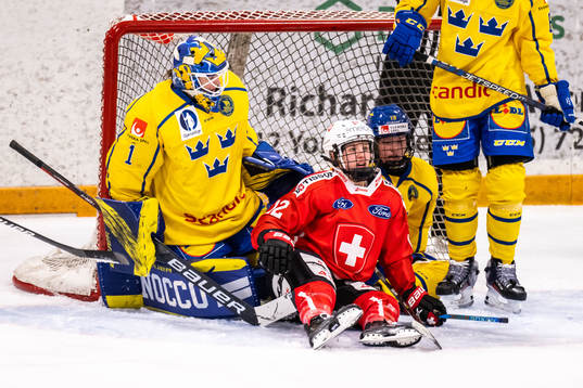 Goaltender Sara Grahn and Sara Hjalmarsson of Sweden and